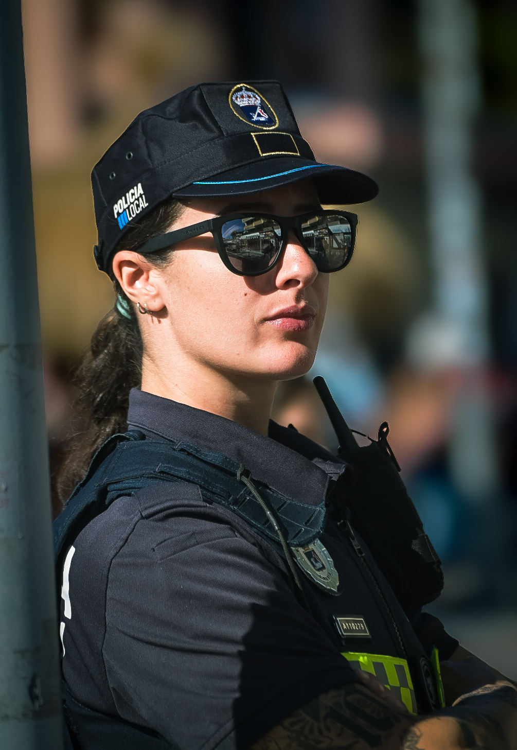 Local police officer in sunglasses watching the race route
