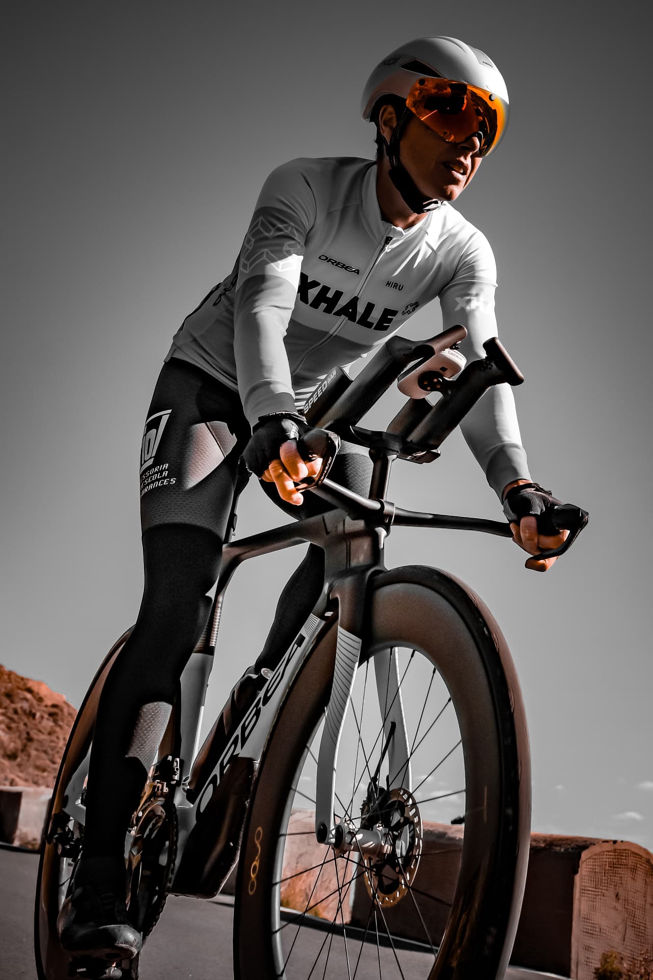 Low angle portrait of a time trial rider on the aero bars